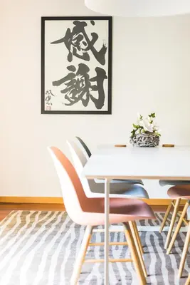 a dining room with a white table and chairs at Pretty Porto Apartment by SOULSHARING.PORTO in Porto