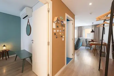 a room with a hallway with a table and chairs at Bloom House by Sweet Porto in Porto