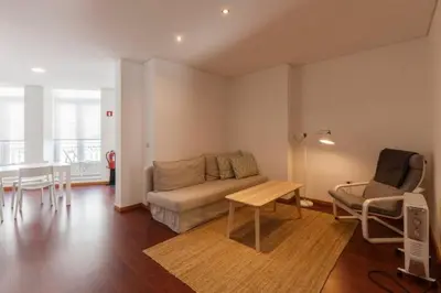 a living room with a couch and a table at GuestReady - Ao Coliseu in Porto