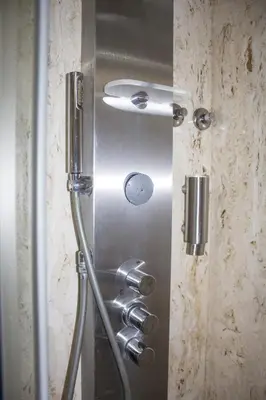 a shower with a metal door in a bathroom at Amazing Amial in Porto