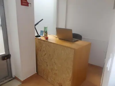 a desk with a laptop computer on top of it at Casa do Largo in Porto