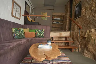 a living room with a couch and a table at Bridge It - Suites & Views in Vila Nova de Gaia