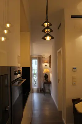 a kitchen with a hallway leading to a dining room at Apartment Garden Music in Porto
