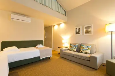 a bedroom with a bed and a couch at RVA - Gustave Eiffel Apartments in Porto
