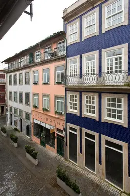 a group of buildings on the side of a street at Braganca Oporto in Porto