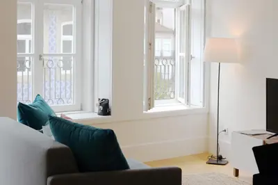 a living room with two windows and a couch at HM - Carlos Alberto Apartment 2 in Porto