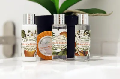 three bottles of essential oils sitting on a table at HM - Carlos Alberto Apartment 2 in Porto