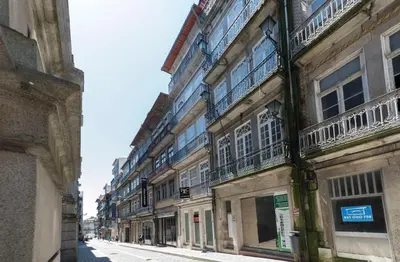 a row of buildings on a city street at LovelyStay - Rico's Apartment - Almada 1ºF in Porto