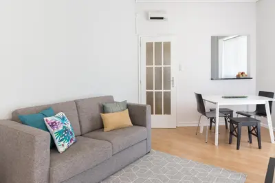 a living room with a couch and a table at Gaia Metro-2 Bedrooms in Vila Nova de Gaia