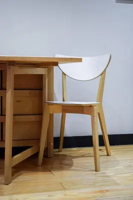 a white chair sitting at a wooden desk at Aurora Sky in Porto