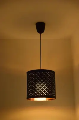 a black light fixture hanging from a ceiling at Aurora Sky in Porto