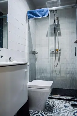 a bathroom with a shower and a toilet and a sink at Aurora Sky in Porto
