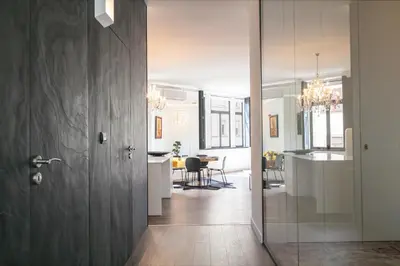 a hallway with a door leading to a dining room at ALQUIMIA DOS ALIADOS - Gorgeous Palace Apartment in Porto