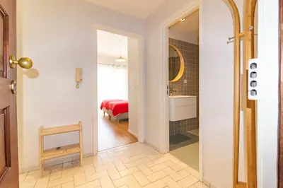 a hallway with a room with a bed and a mirror at Cedofeita 408, Green in Porto