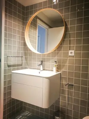 a bathroom with a white sink and a mirror at Cedofeita 408, Green in Porto