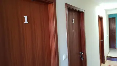 a door in a room with two different doors at O Ninho in Vila Nova de Gaia