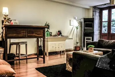 a living room with a couch and a table at The Poets Inn in Porto