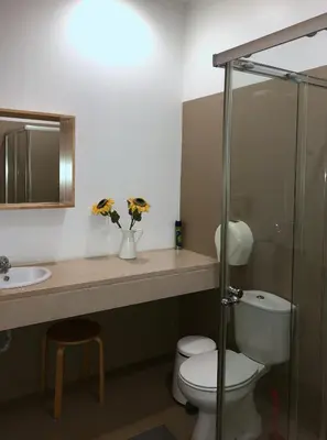 a bathroom with a toilet and a sink at The Poets Inn in Porto