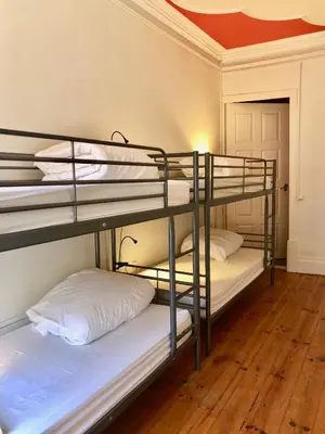 two bunk beds in a room with a ceiling at Porto Republica Downtown in Porto