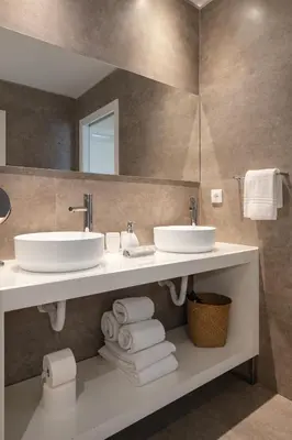 a bathroom with two sinks and a mirror at Ribeira Apartments Santa Catarina in Porto