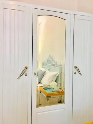 a glass door with a reflection of a bed at BS Villas Porto in Porto
