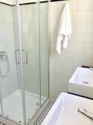 a bathroom with a shower and a sink at BS Villas Porto in Porto