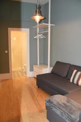 a living room with a couch and a table at Porto Traveler Apartment in Porto