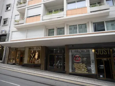a store front of a building on a street at Unique Penthouse Porto near Livaria Lello - 40m2 Terrace and Free Parking in Porto
