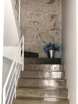 a staircase with a stone wall and a potted plant at URBAN VIEWS Terrace - Duplex Apartment 