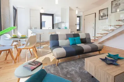 a living room with a couch and a table at URBAN VIEWS Terrace - Duplex Apartment 