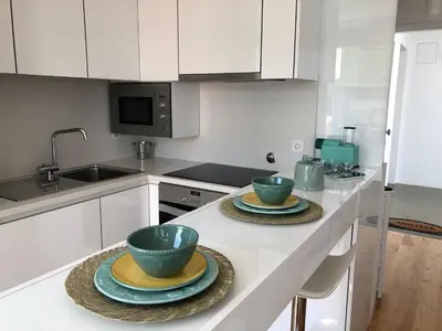 a kitchen with two bowls and plates on a counter at URBAN VIEWS Terrace - Duplex Apartment 