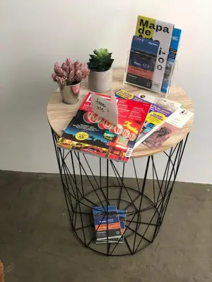 a small table with books and magazines on it at URBAN VIEWS Terrace - Duplex Apartment 