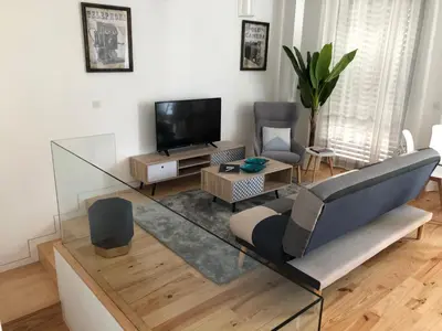 a living room with a couch and a tv at URBAN VIEWS Terrace - Duplex Apartment 