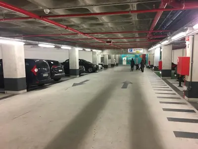 an empty parking garage with cars parked in it at LUXURY Golden River Apartment - In the Heart of city center and wine cellars in Vila Nova de Gaia