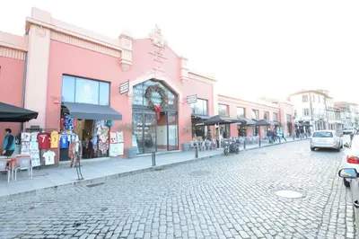 a cobblestone street in a city with buildings at LUXURY Golden River Apartment - In the Heart of city center and wine cellars in Vila Nova de Gaia