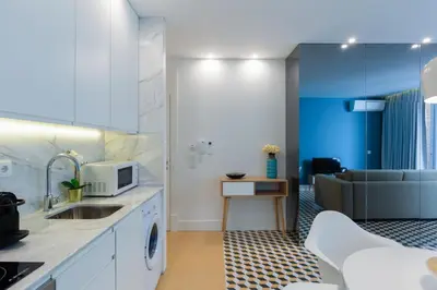 a kitchen with a sink and a microwave at Porto Blue Terrace in Porto