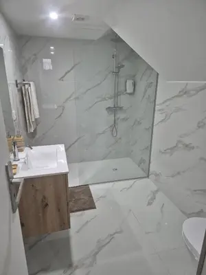 a bathroom with a shower and a sink at Downtown Porto Bonfim Studio Apt in Porto