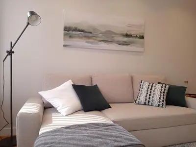 a couch with pillows on it in a living room at Porto Soul by Flat in Porto in Porto