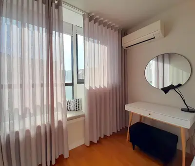 a room with a desk and a mirror and a window at Porto Soul by Flat in Porto in Porto