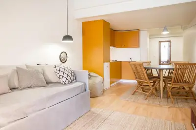 a living room with a couch and a table at Republica Apartments at D. Luis I Bridge in Vila Nova de Gaia