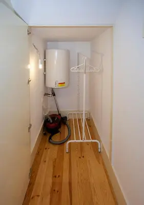 a room with a water tank in the corner of a room at Liiiving in Porto | Central Secret Balcony in Porto