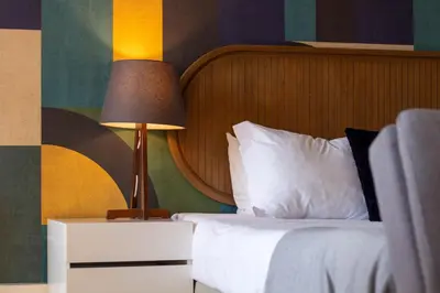 a bedroom with a bed and a lamp on a night stand at LovelyStay - Dirk Apartment - Almada 4º F in Porto
