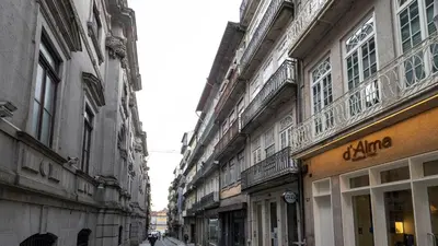 an empty street with buildings in a city at LovelyStay - Allderman Apartment - Almada 3º F in Porto