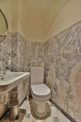 a bathroom with a toilet and a sink at Republica 157 Guest House in Porto