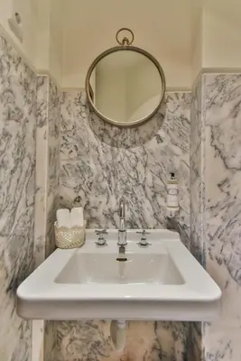 a bathroom with a sink and a mirror at Republica 157 Guest House in Porto