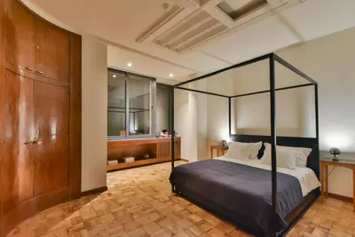 a bedroom with a canopy bed in a room at Republica 157 Guest House in Porto