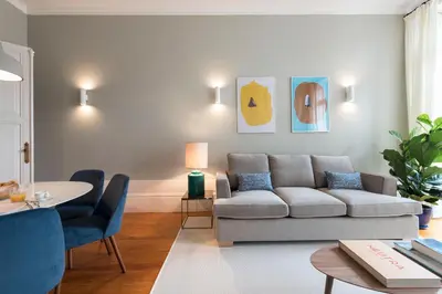 a living room with a couch and a table at LovelyStay - Flower Stylish Apartment in Porto