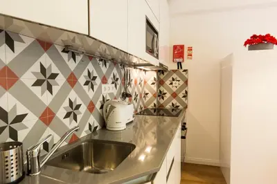 a kitchen with a sink and a counter top at Porto Haven - Marquês Downtown in Porto