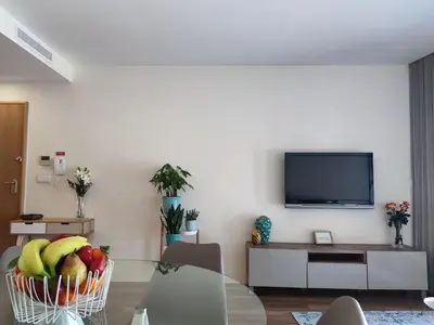 a living room with a basket of fruit on a table at Trindade Apartments in Porto