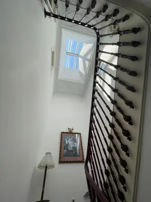 a stairway with a bunch of wine bottles at Casa Portugueza Experience in Porto